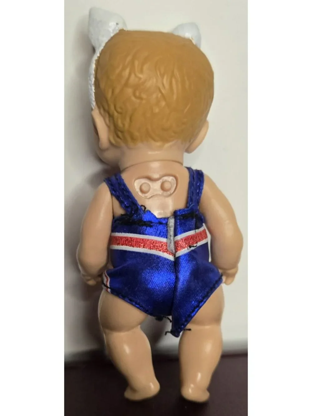 Zapf Creations Baby Born Mini Surprise Doll With Union Jack Swimsuit